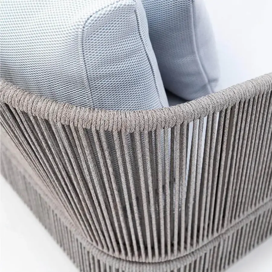 Elegant Varaschin Tibidabo lounger with a silk grey frame expertly woven in Perla Rope and light blue cushions