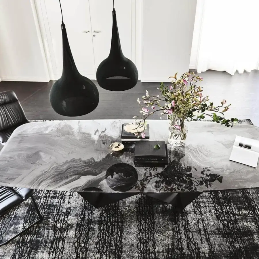 Elegant Cattelan Italia Skorpio table with extra-clear bevelled glass and titanium embossed lacquered steel base