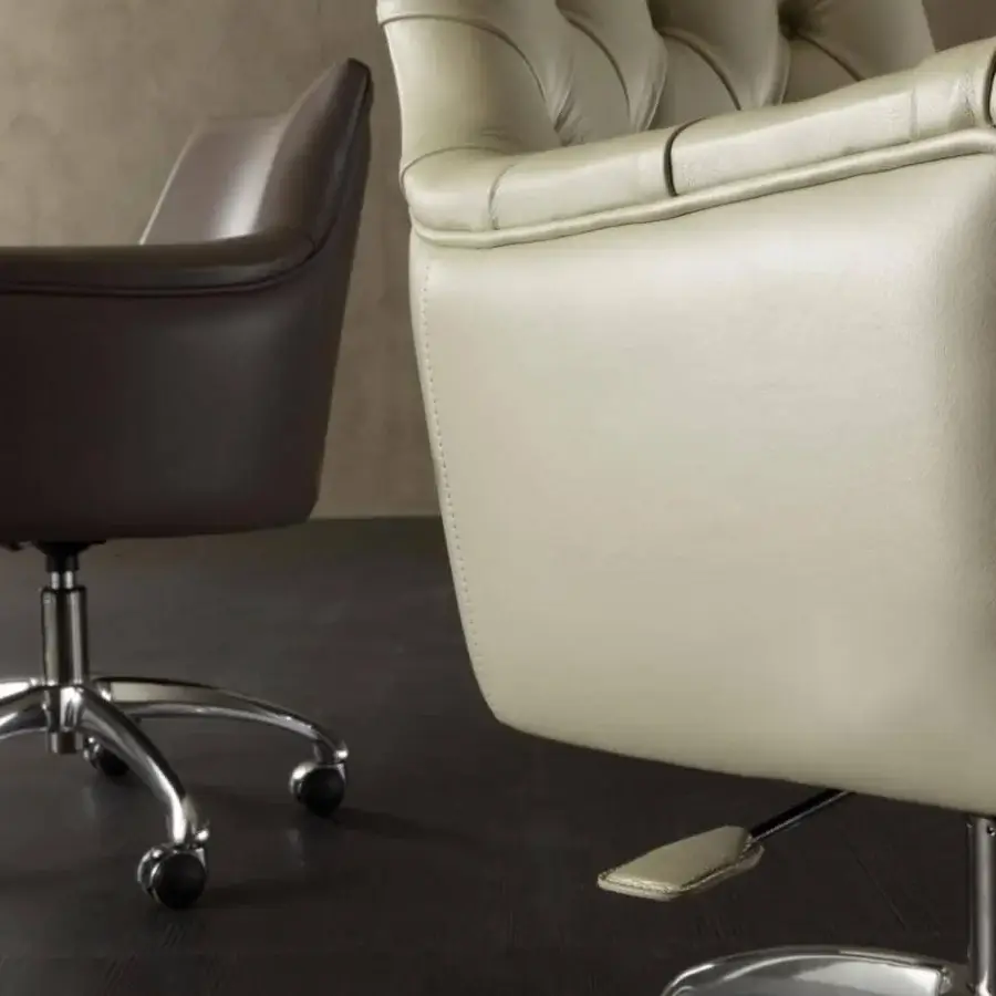 Elegant Rugiano Itaca office armchair upholstered in light beige leather with a refined tufted finish and polished steel base