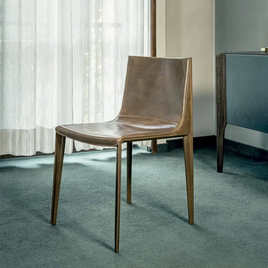 Exceptional Arketipo Emily chair with wide seating and low back upholstered in smooth brown vegetable-tanned Dirt leather with visible stitching