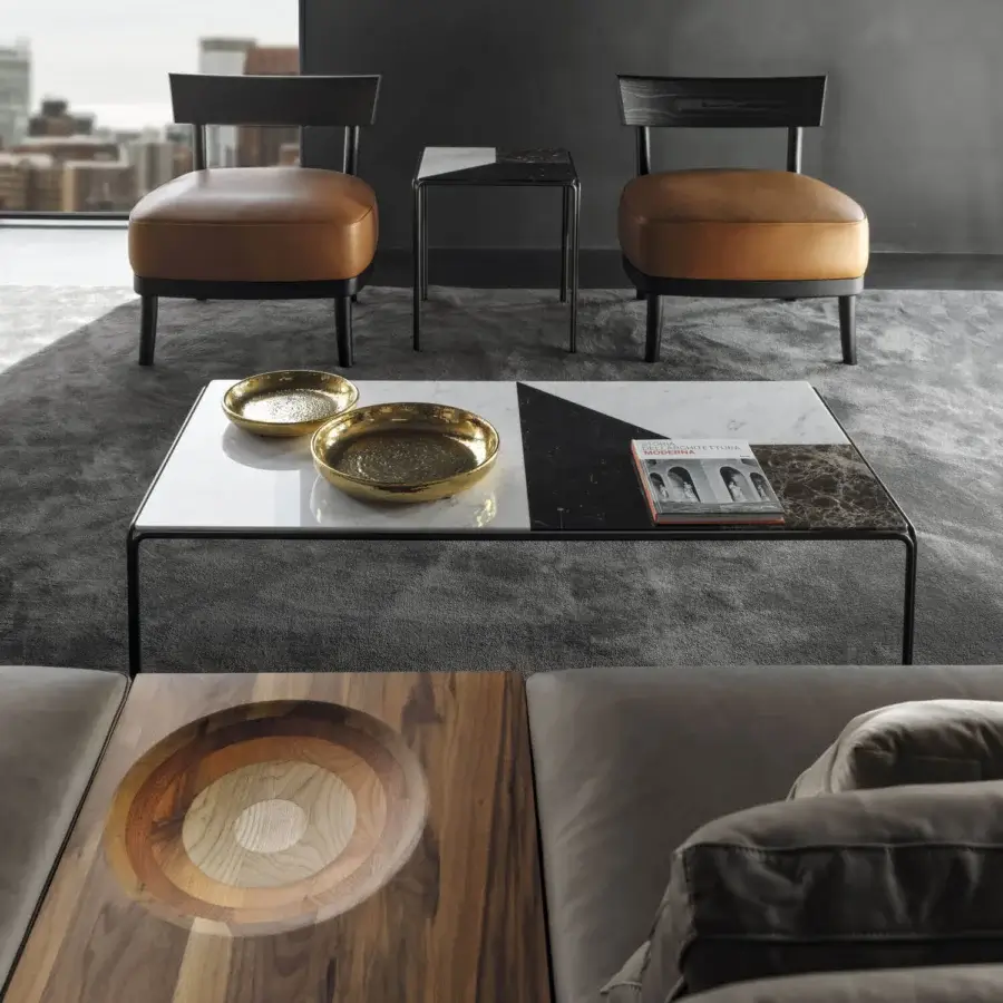 Distinguished Horm Ragtime coffee table built with bronze painted metal and a geometric Carrara, Emperador, Marquina marble tabletop