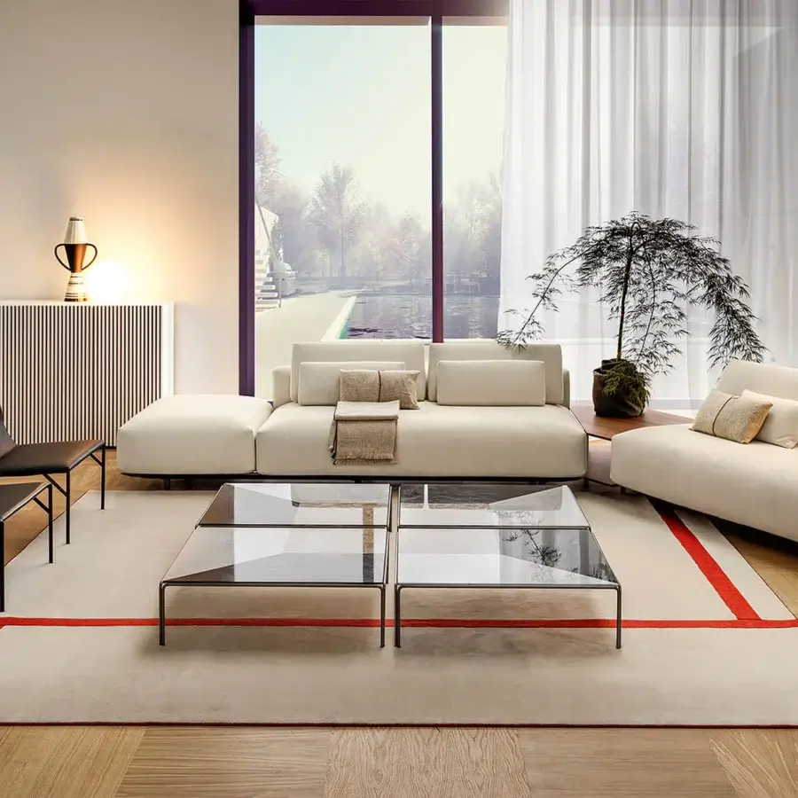 Elegant Horm Ragtime coffee table with bronze painted metal structure and smoky glass top