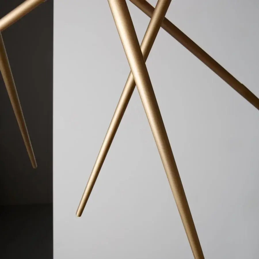 Distinguished VENICEM Spear chandelier with intersecting cylindrical rods in light burnished brass and metal construction