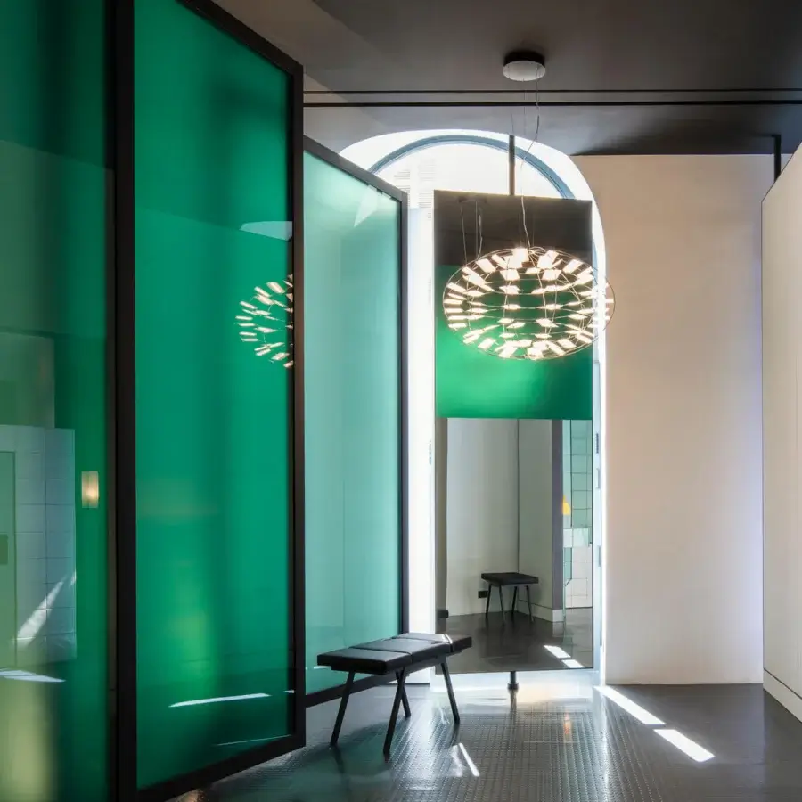 Exceptional Nemo Chloris suspension lamp explores atmospheric lighting with polycarbonate diffusers in a reflective metallic frame