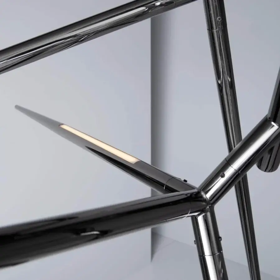 Innovative VENICEM Spear chandelier with geometrically intersecting arms in polished black nickel and strip LED illumination