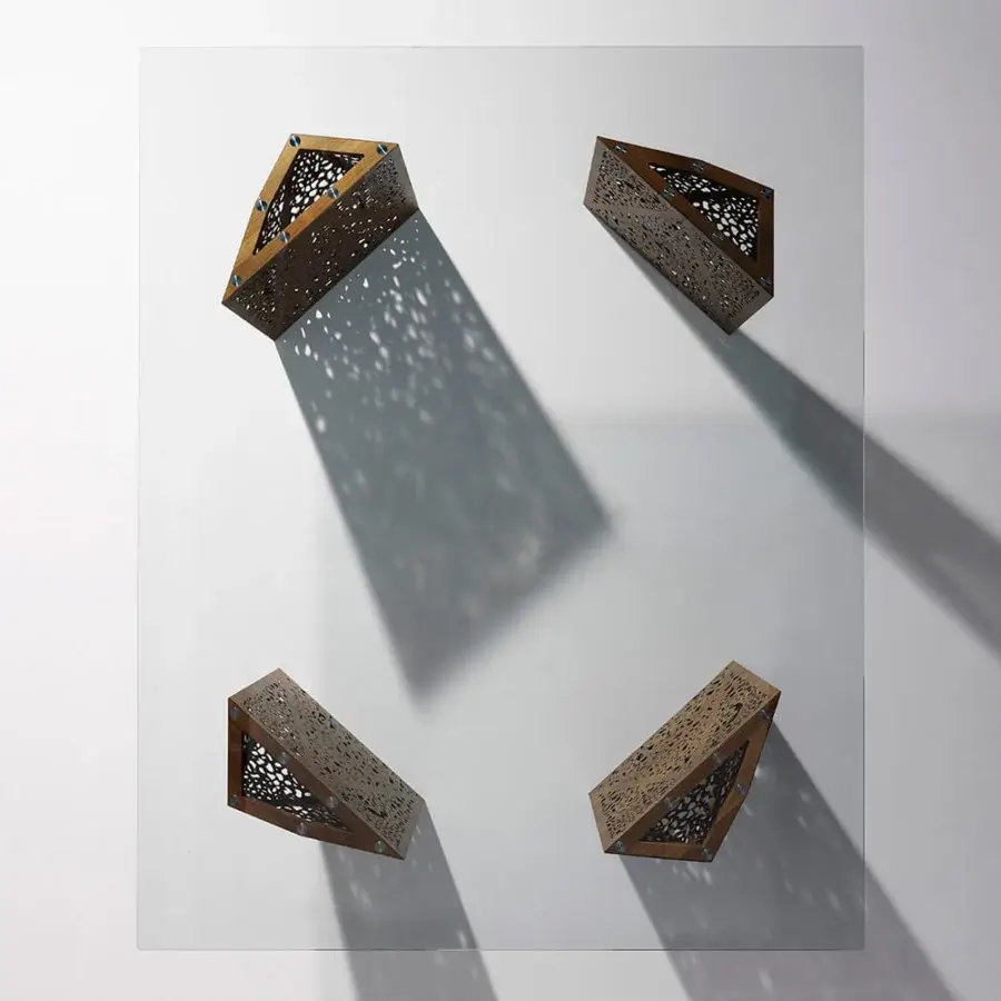 Distinguished Horm Riddled table with medium-toned brown laser-engraved wood legs and minimalist square glass top crafted in Italy
