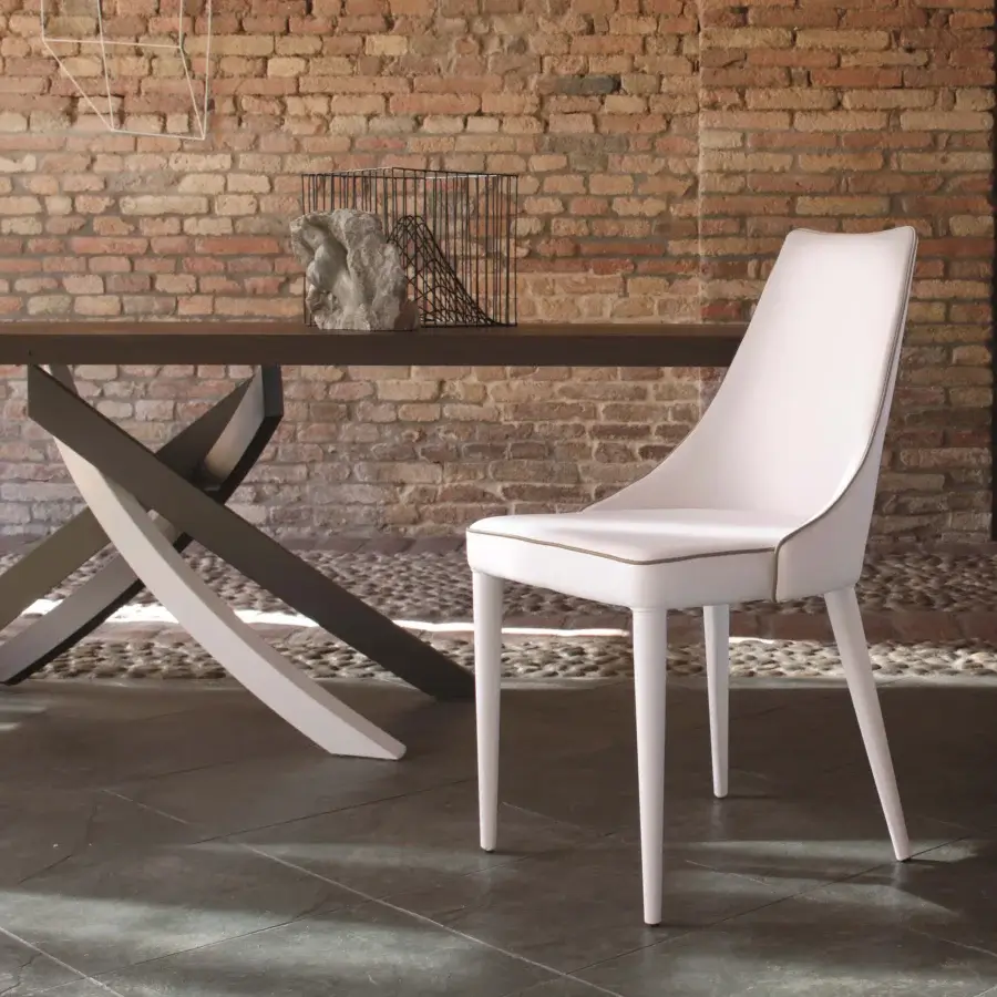 Elegant Bontempi Clara chair crafted in Italy with smooth light cream upholstery and slender matching legs
