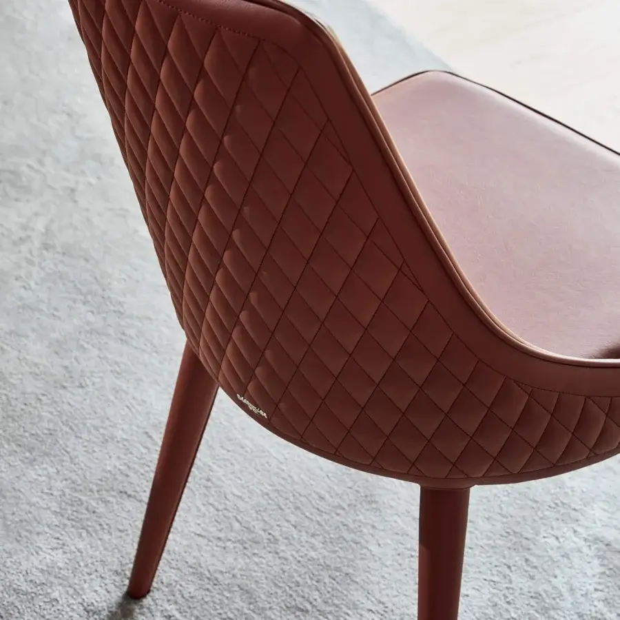 Superior Bontempi Clara chair upholstered in reddish-brown leather or synthetic material with quilted back and matching piping