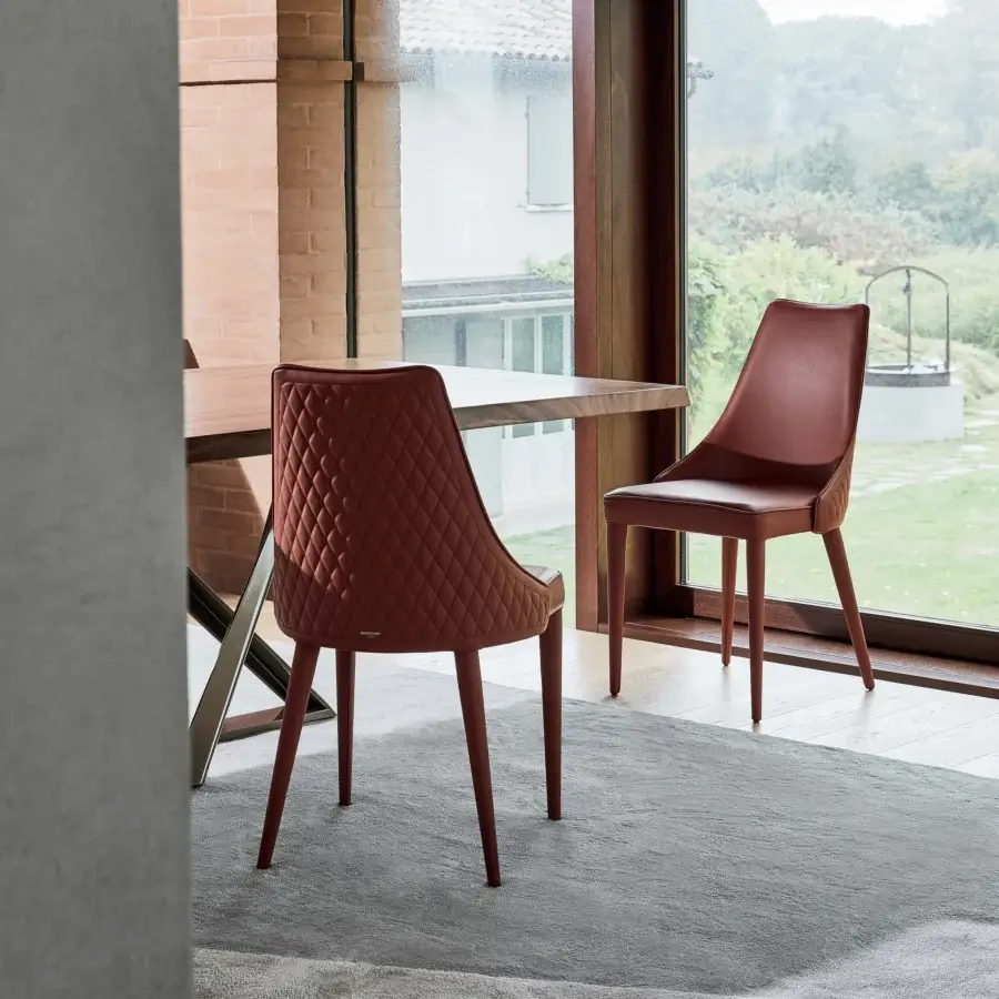 Exceptional Bontempi Clara chair upholstered in reddish-brown textile with quilted stitching and slender matching legs