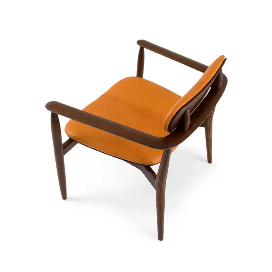 Sophisticated Borzalino Regina lounge chair with ergonomic design and warm orange-brown leather upholstery built with dark brown wood