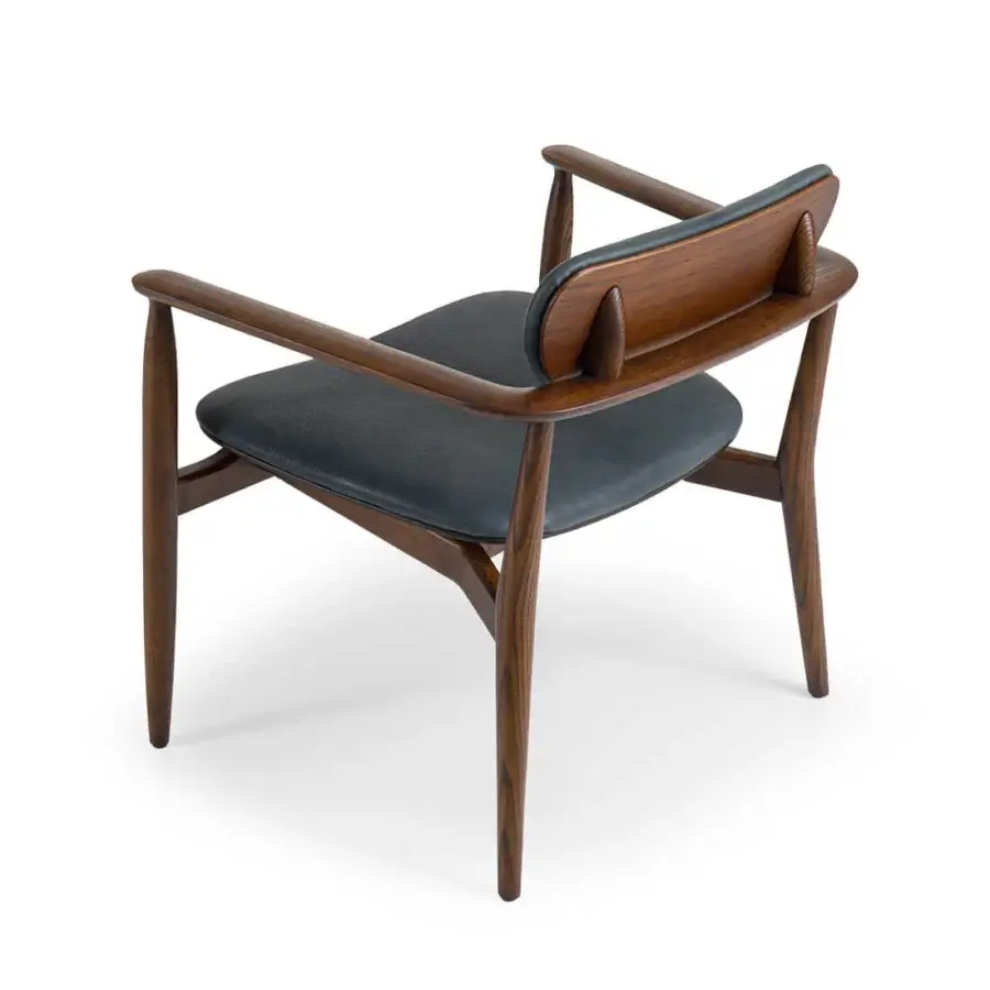 Distinguished Borzalino Regina lounge chair with a solid wood structure upholstered in dark material reflecting Italian craftsmanship