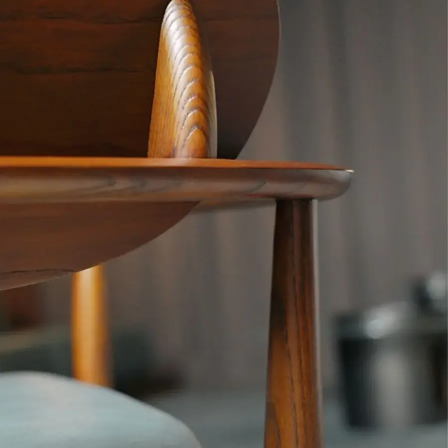Sophisticated Borzalino Regina lounge chair crafted with a solid wood structure and inviting muted blue fabric upholstery with a rich finish