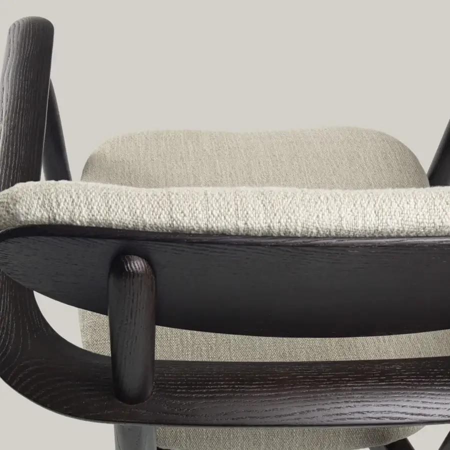 Elegant Borzalino Regina chair built in Italy with light textile upholstery and dark matte-stained wood grain