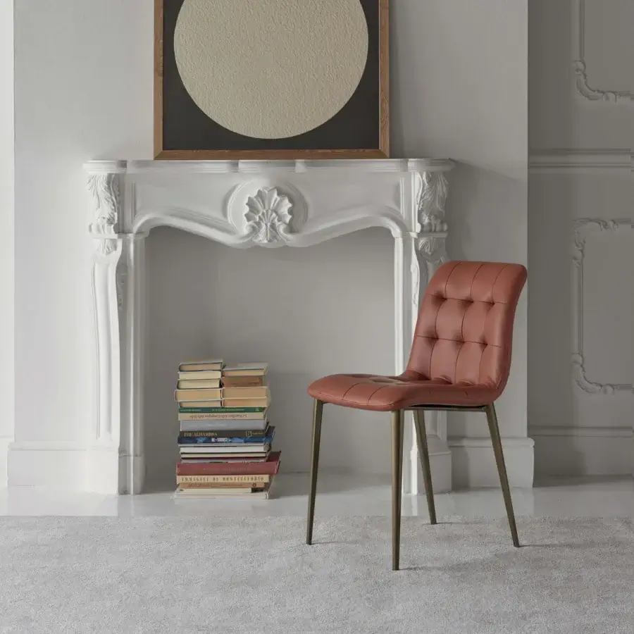 Superior Bontempi Kuga chair with reddish-brown tufted upholstery and sleek golden metal frame and legs