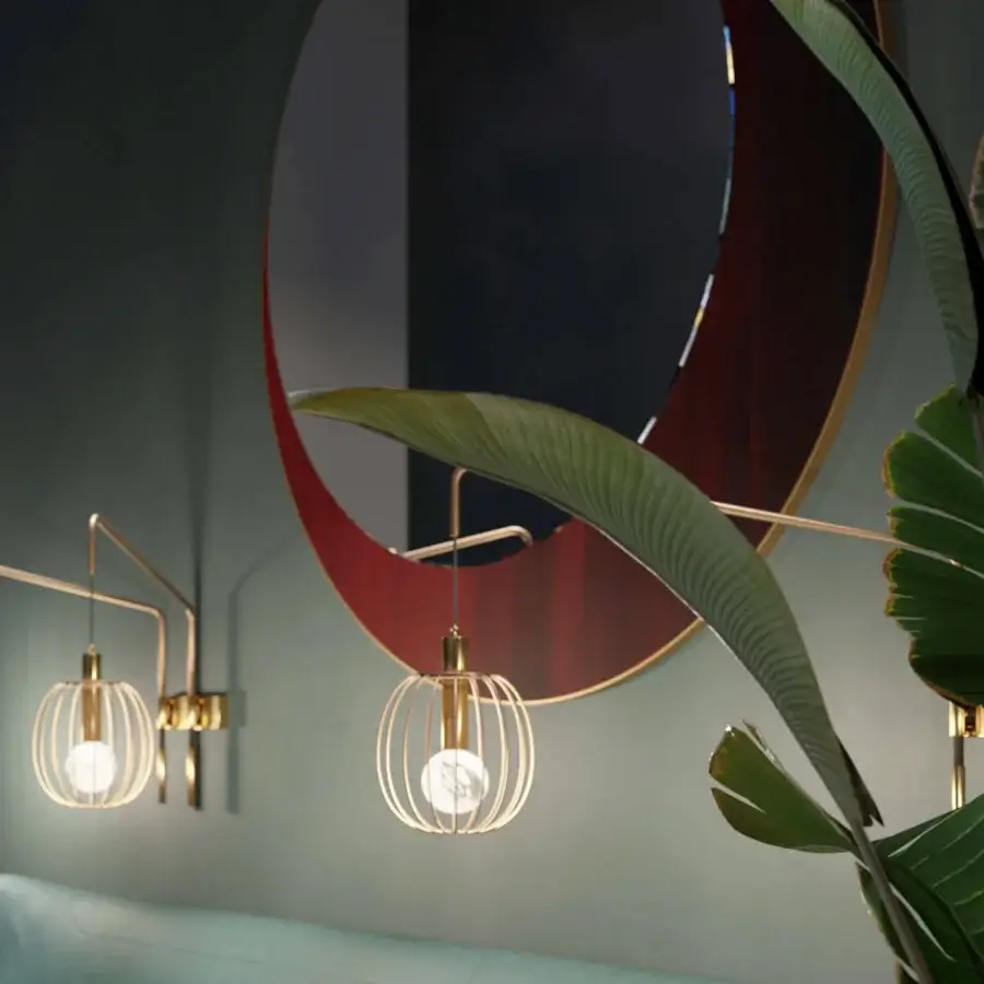 Exclusive Borzalino Eclipse mirror with a captivating circular form built in treated brass metal and a red arc