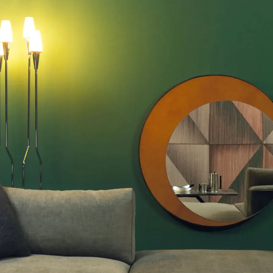 Superior Borzalino Eclipse mirror with a circular silhouette crafted in treated brass and warm tan leather with a matte finish