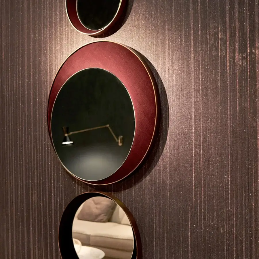 Elegant Borzalino Eclipse mirror with a circular design crafted in treated brass and reddish-brown leather or fabric