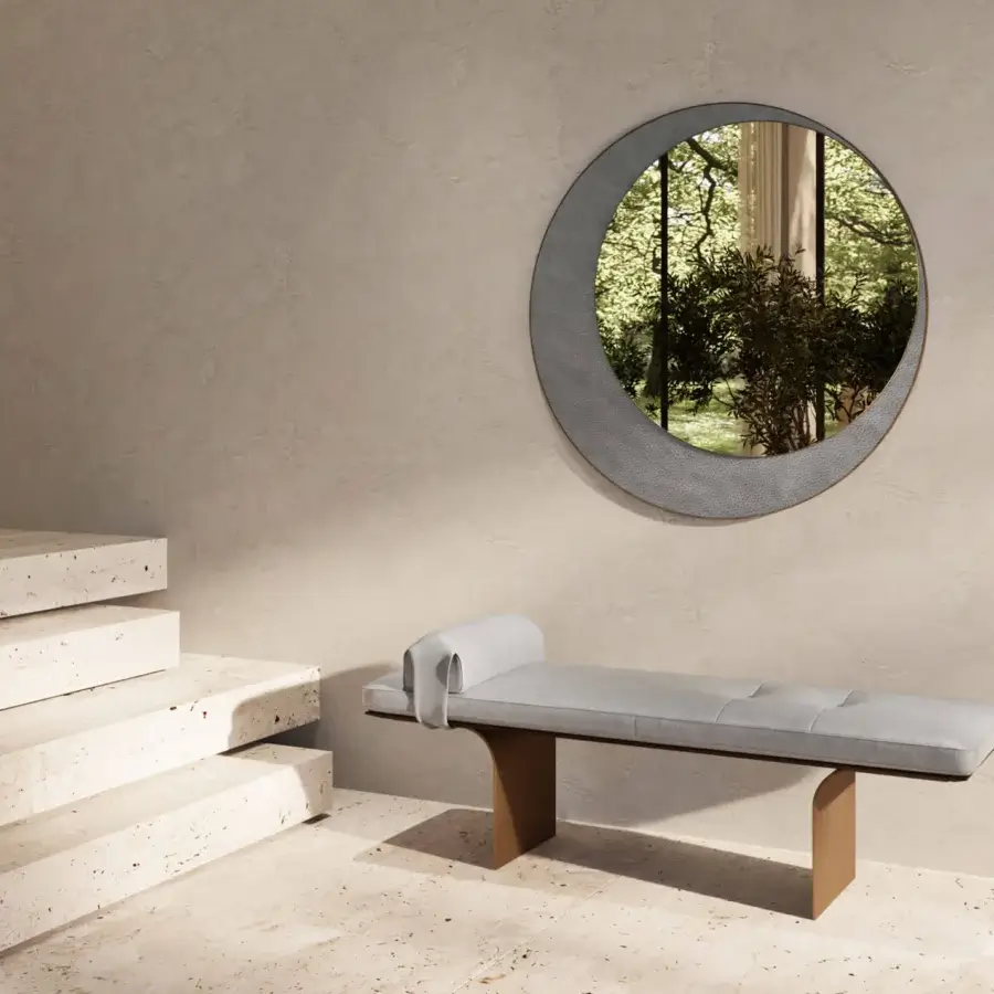 Distinguished Borzalino Eclipse mirror with a crescent silhouette crafted in treated brass and textured gray leather