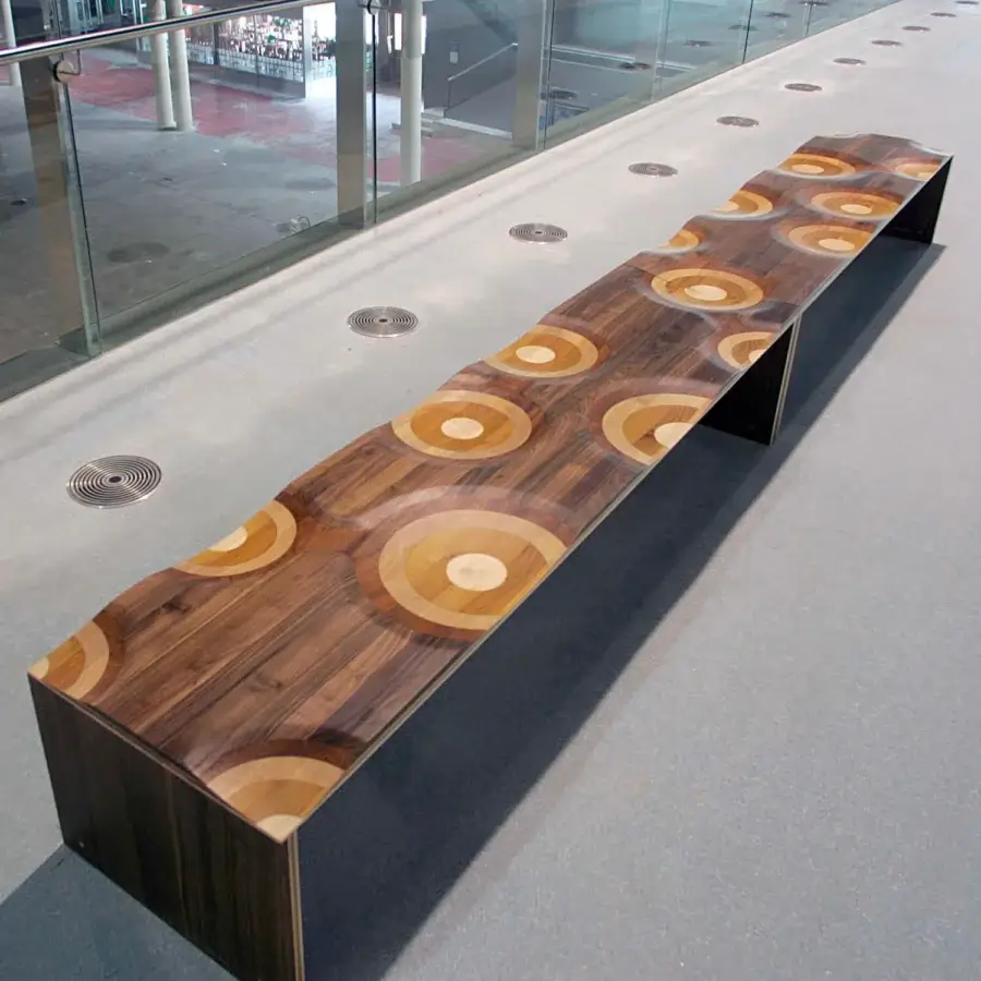 Luxury Horm Ripples bench crafted from laminated walnut, mahogany, cherry, oak, and ash with a hand-finished polychromatic surface