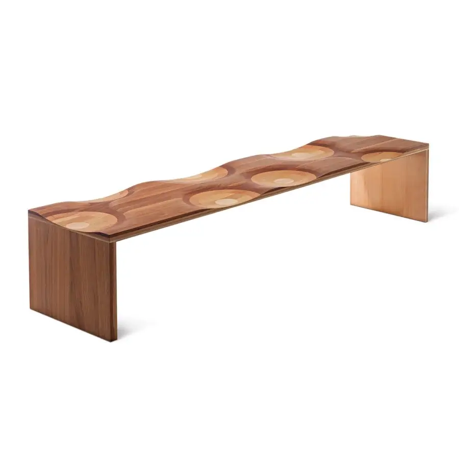 Lavish Horm Ripples bench showcases undulating laminated walnut, mahogany, cherry, oak, and ash with hand-finished transitions