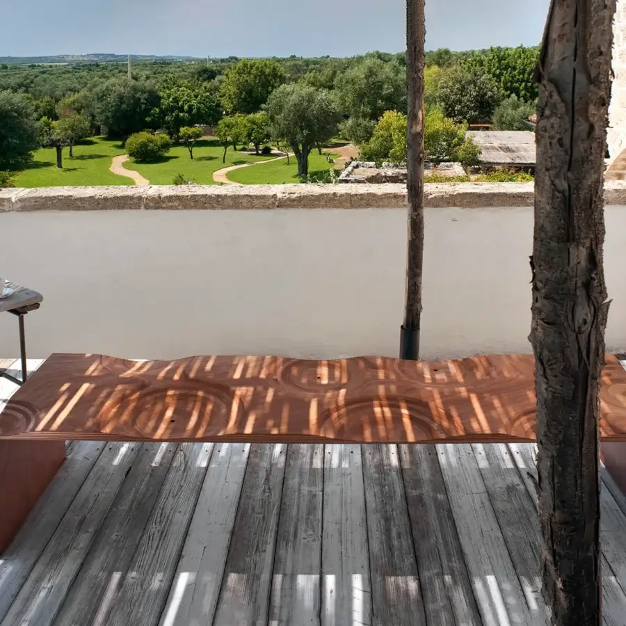 Distinguished Horm Ripples bench crafted in Italy with undulating okoume wood and layered plywood edges