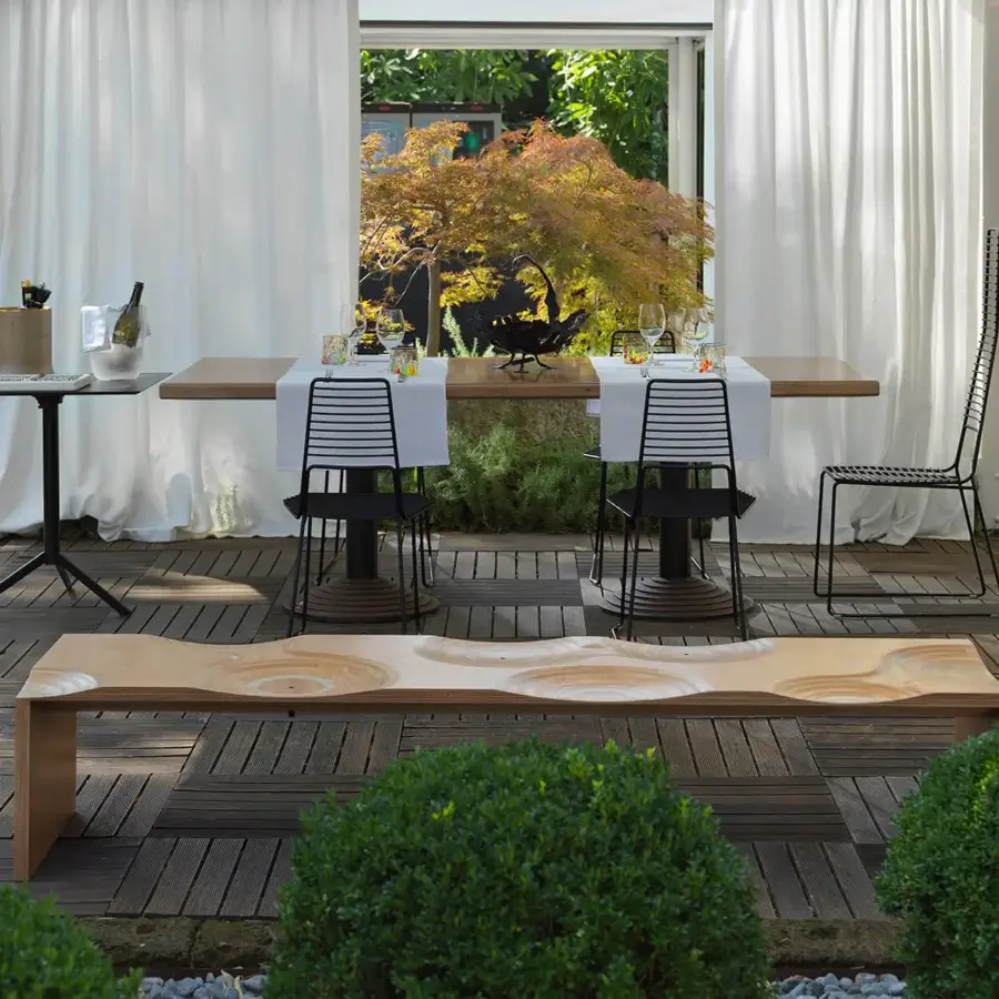 Exceptional Horm Ripples bench crafted in okoume wood with smooth finish and captivating undulating patterns evoking topographical contour lines