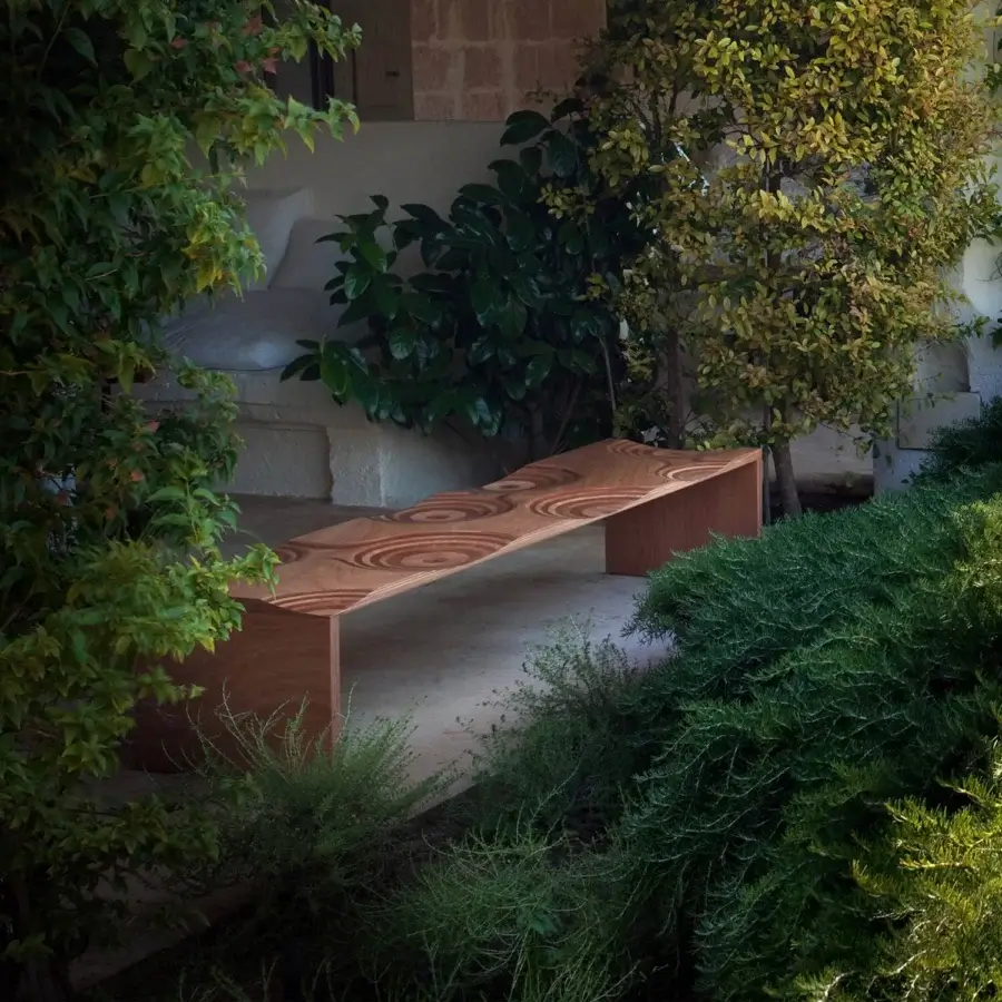 Distinguished Horm Ripples bench crafted in Italy with warm brown okoume wood and concentric circular patterns