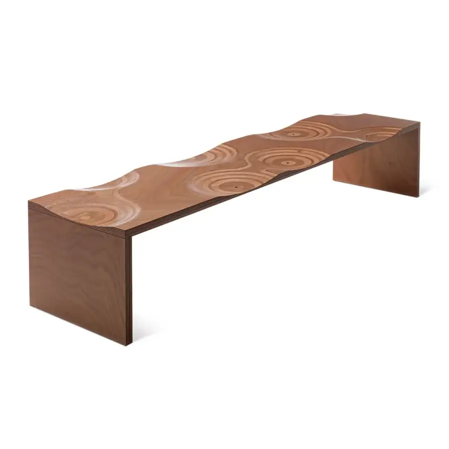 Captivating Horm Ripples bench crafted in Italy with medium-brown okoume wood exhibiting concentric circular patterns