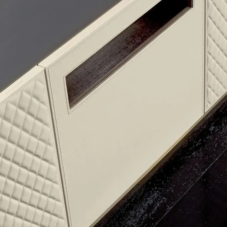 Lavish Rugiano Boston sideboard with cream leather, matelassé embroidery and dark top surface