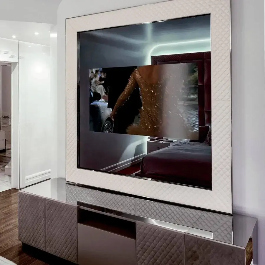 Sophisticated Rugiano Ghost TV mirror with medium gray textile, matelassé embroidery and sleek steel metal details