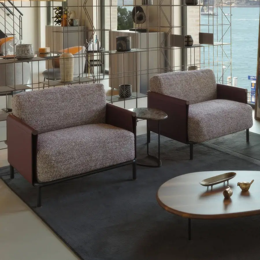 Lavish Horm SC2 lounge chair with speckled woven textile cushions, Canaletto walnut details and black painted tubular cage construction