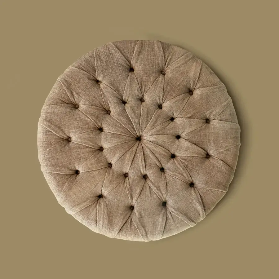 Elegant Borzalino New Kap ottoman crafted in light brown textured fabric with meticulous handmade capitonné quilting