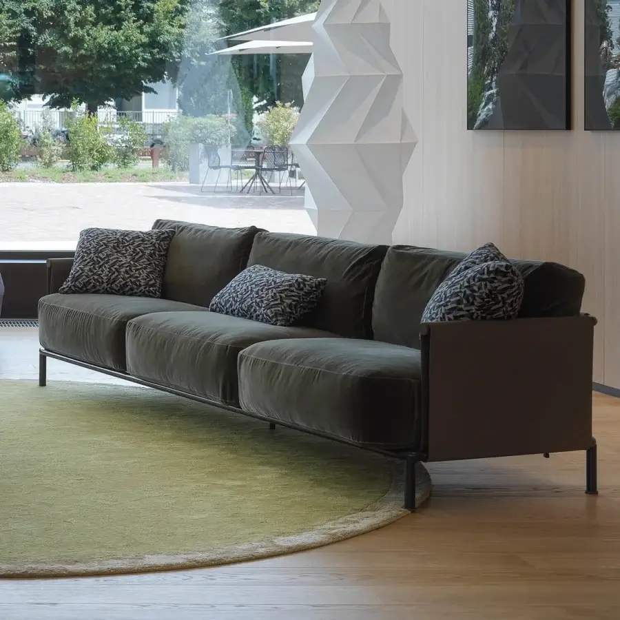 Superior Horm SC2 sofa with a black painted tubular cage and Canaletto walnut details upholstered in dark greenish-brown textile with a matte finish