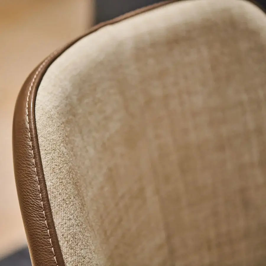 Exceptional Borzalino Julie chair with warm tan fabric and smooth brown leather bi-cover, built with a solid natural oak base