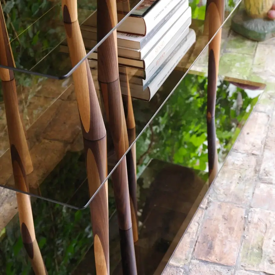 Distinguished Horm Sendai bookcase with six clear glass shelves connected by uniquely turned solid wood elements