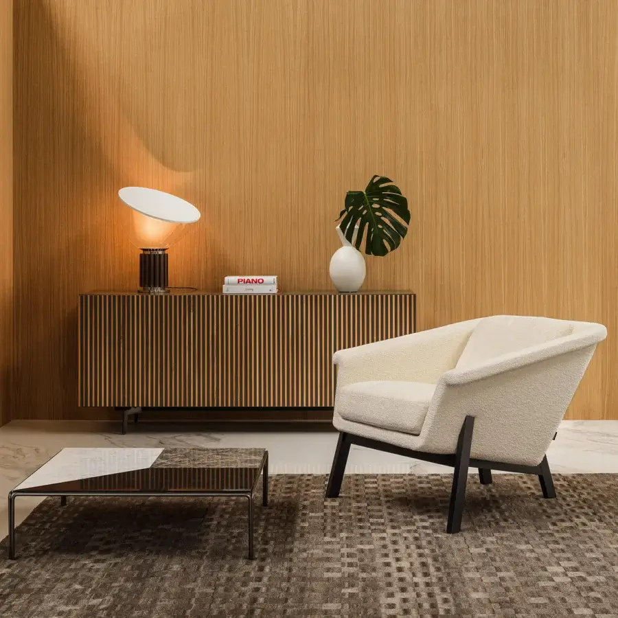 Superior Horm Sienna lounge chair with enveloping comfort upholstered in cream fabric and dark finished wooden legs