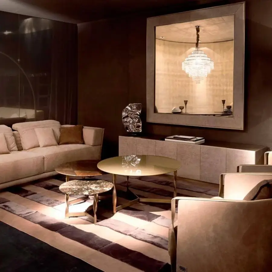 Exclusive Rugiano Empire sofa upholstered in light beige velvet-like fabric with quilted detailing and a bronze metal base
