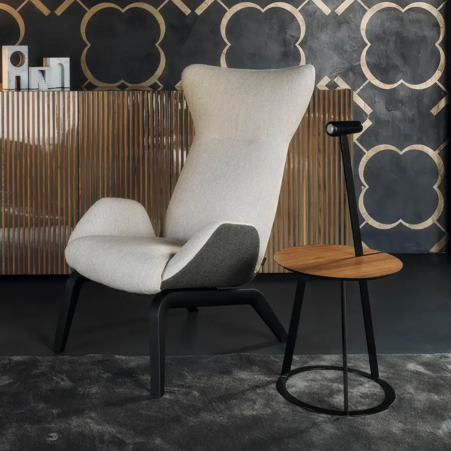 Superior Horm Soho lounge chair with enveloping light woven fabric and dark matte painted angular wood base