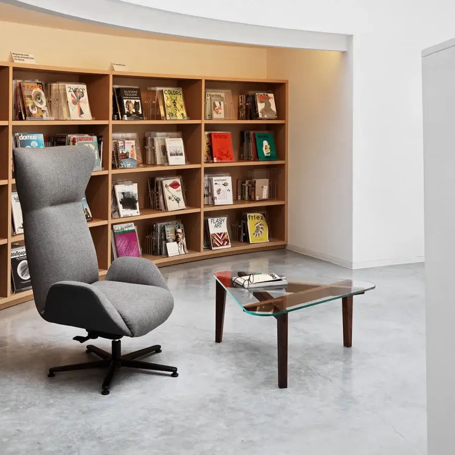 Distinctive Horm Soho lounge chair with enveloping medium gray fabric and sleek black four-legged base