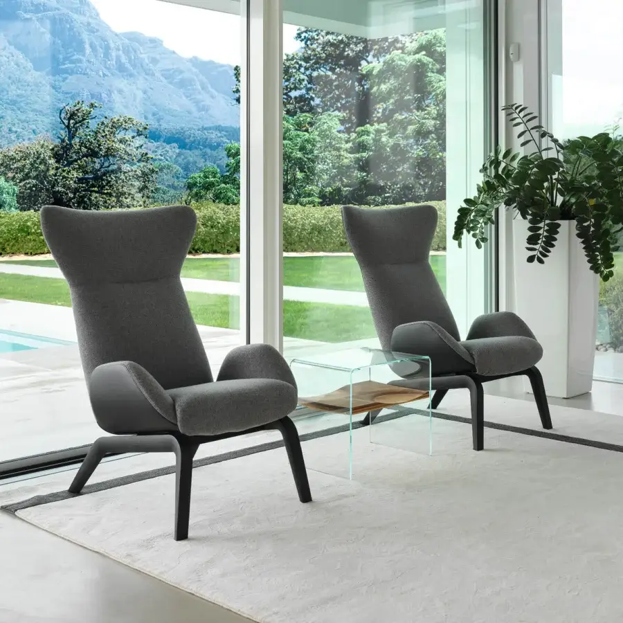 Distinguished Horm Soho lounge chair with soft gray woven textile and dark-toned angular wooden base