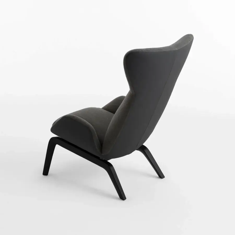 Elegant Horm Soho lounge chair with enveloping gray textile and meticulous dark finished wooden legs