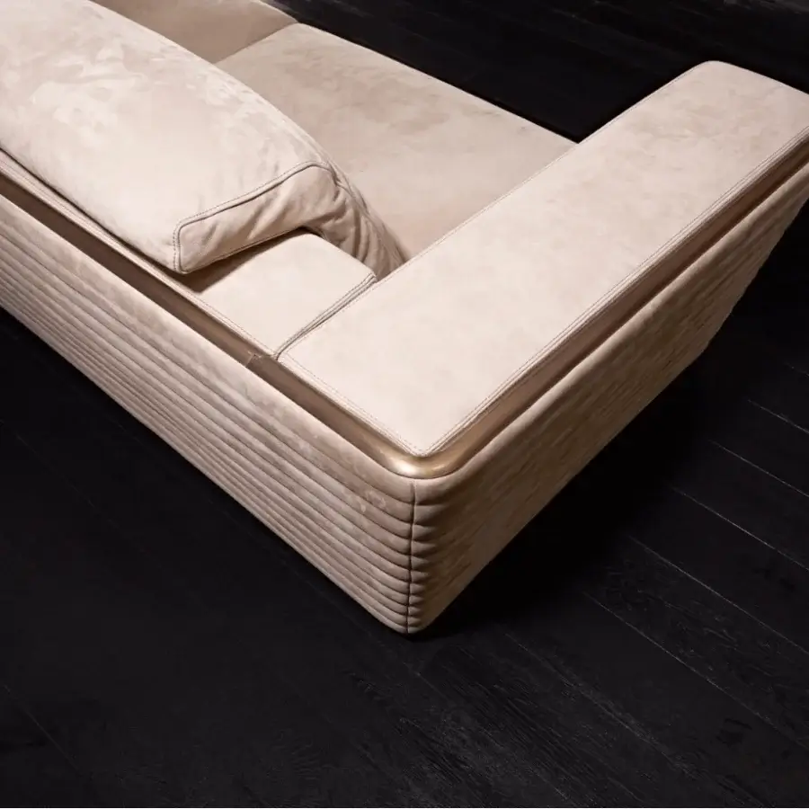 Exclusive Rugiano Empire sofa with a geometric silhouette upholstered in light beige textile and bronze metal trim