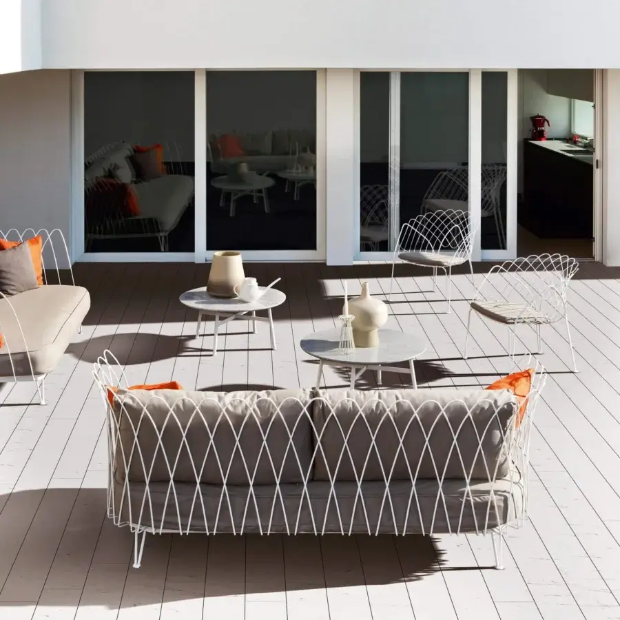 Distinguished Varaschin Summer Set coffee table with a round tabletop crafted in HPL or ceramic and a matte white powder-coated steel frame