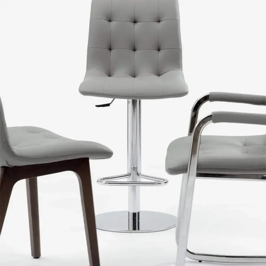 Sophisticated Bontempi Kuga stool upholstered in light gray material with tufted detailing and a shiny chrome base