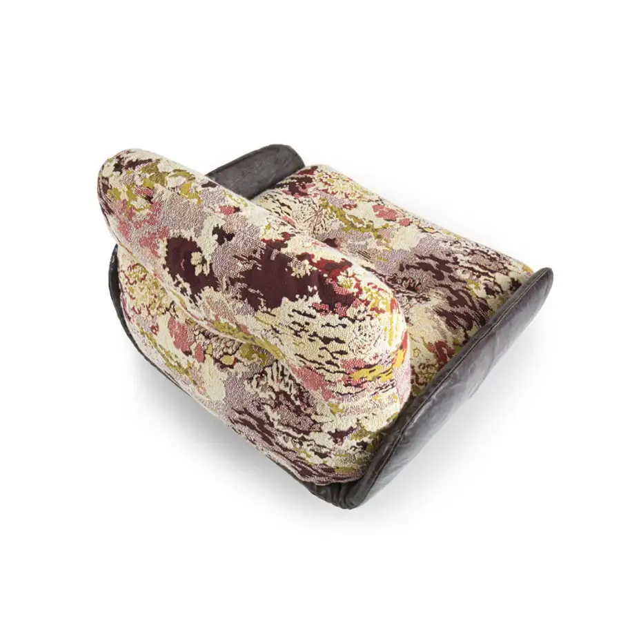 Lavish Borzalino Ayton lounge chair upholstered in floral textile with burgundy, cream, yellow, and pink hues with a leather structure and lacquered feet