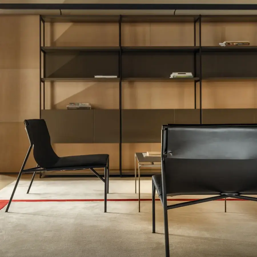 Distinguished Horm Tout Le Jour lounge chair with a geometric silhouette crafted in matte black metal and black leather upholstery