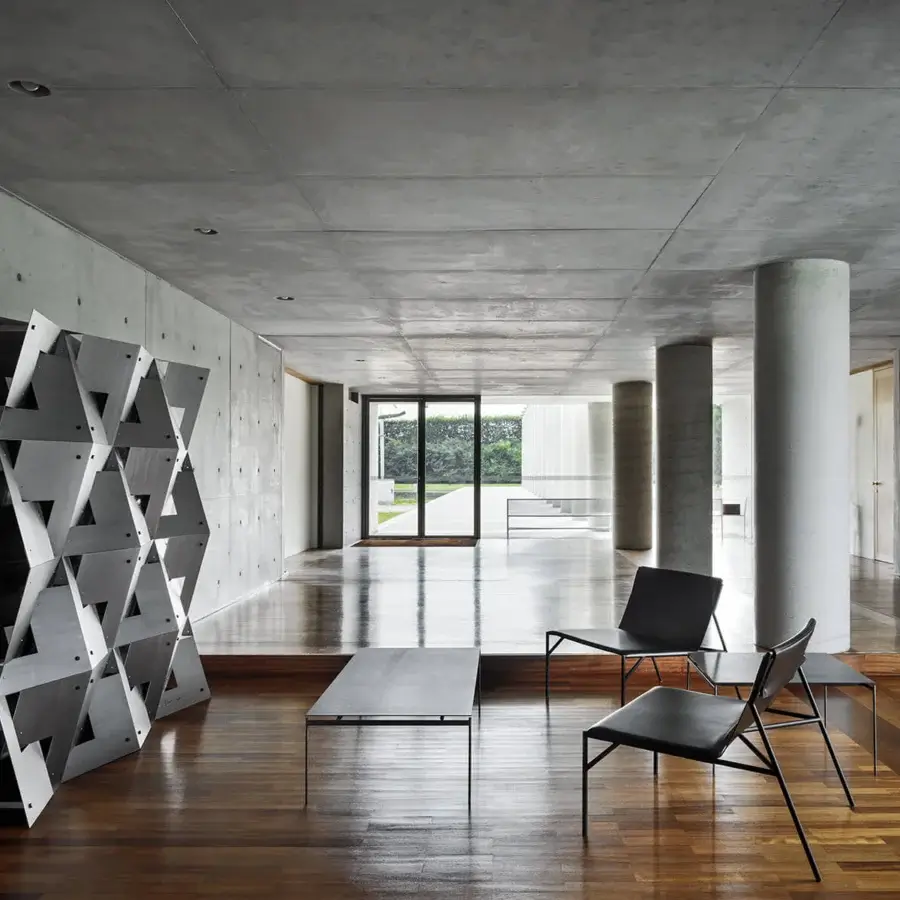 Superior Horm Tout Le Jour lounge chair with matte black metal framing and dark leather seating built in Italy