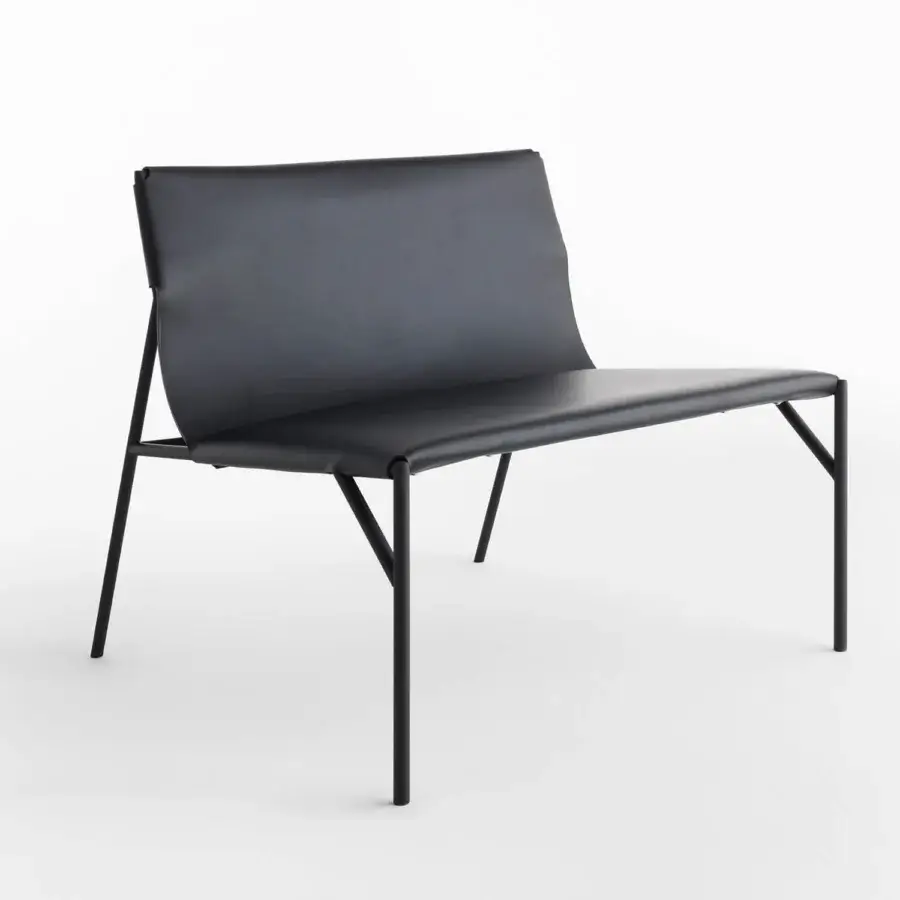 Distinguished Horm Tout Le Jour lounge chair crafted in black metal and synthetic material with a sleek, angular silhouette