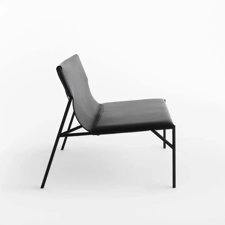 Sophisticated Horm Tout Le Jour lounge chair built in black leather and premium metal with angled legs