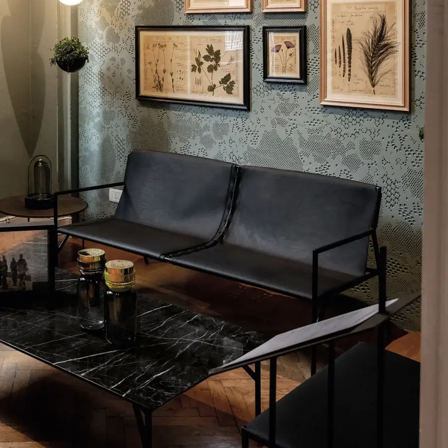 Exclusive Horm Tout Le Jour sofa crafted in Italy with black leather upholstery and a matte metal frame